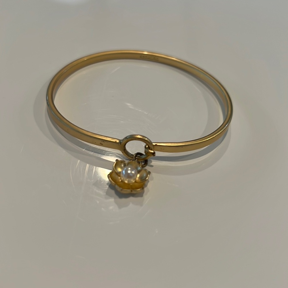 Spartina 449 gold bangle with flower charm